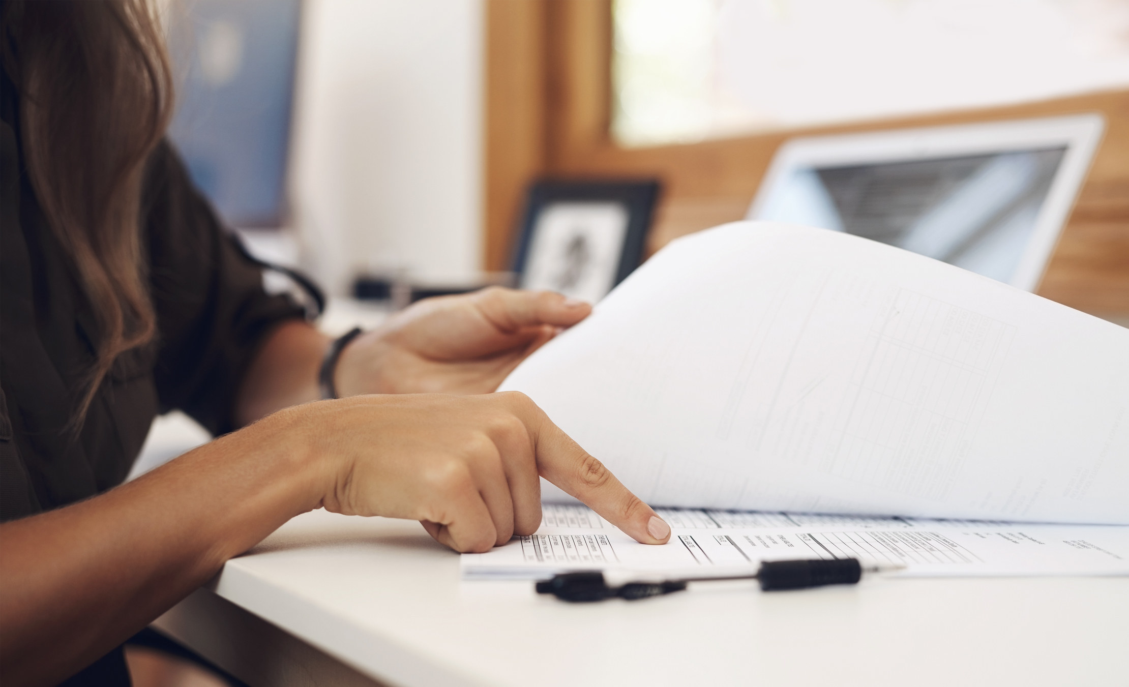 A woman reading important papers