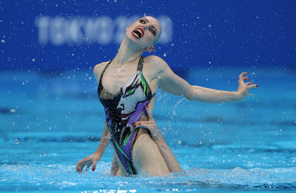 A women swimmer performs in the pool at the Tokyo Olympics