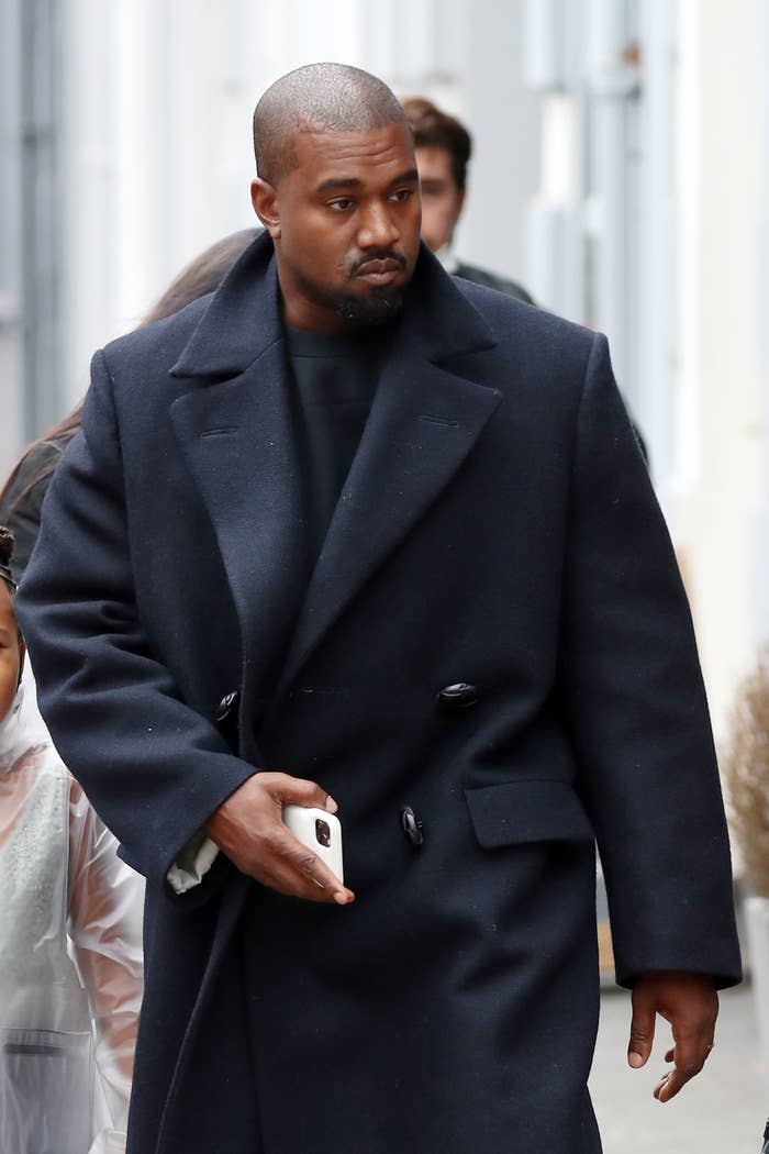 Kanye West is photographed walking outside in London in 2020