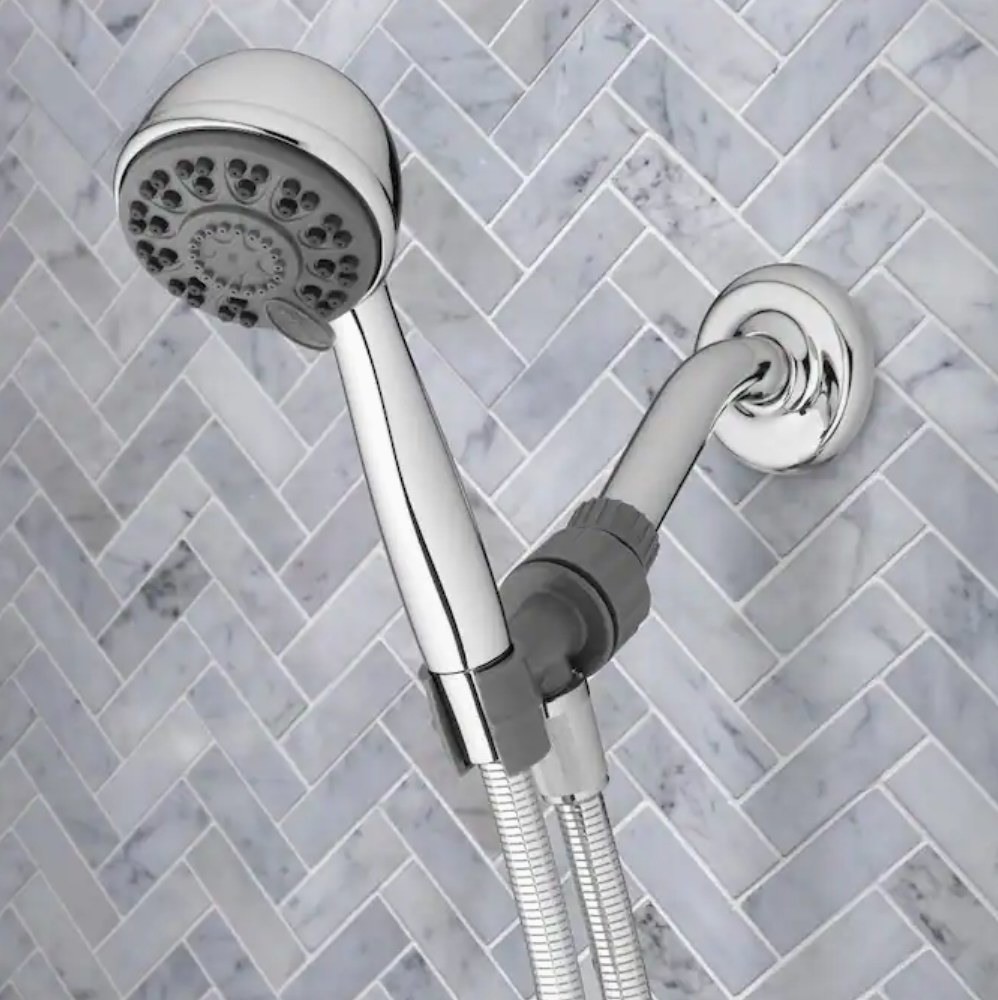 Silver shower head in shower