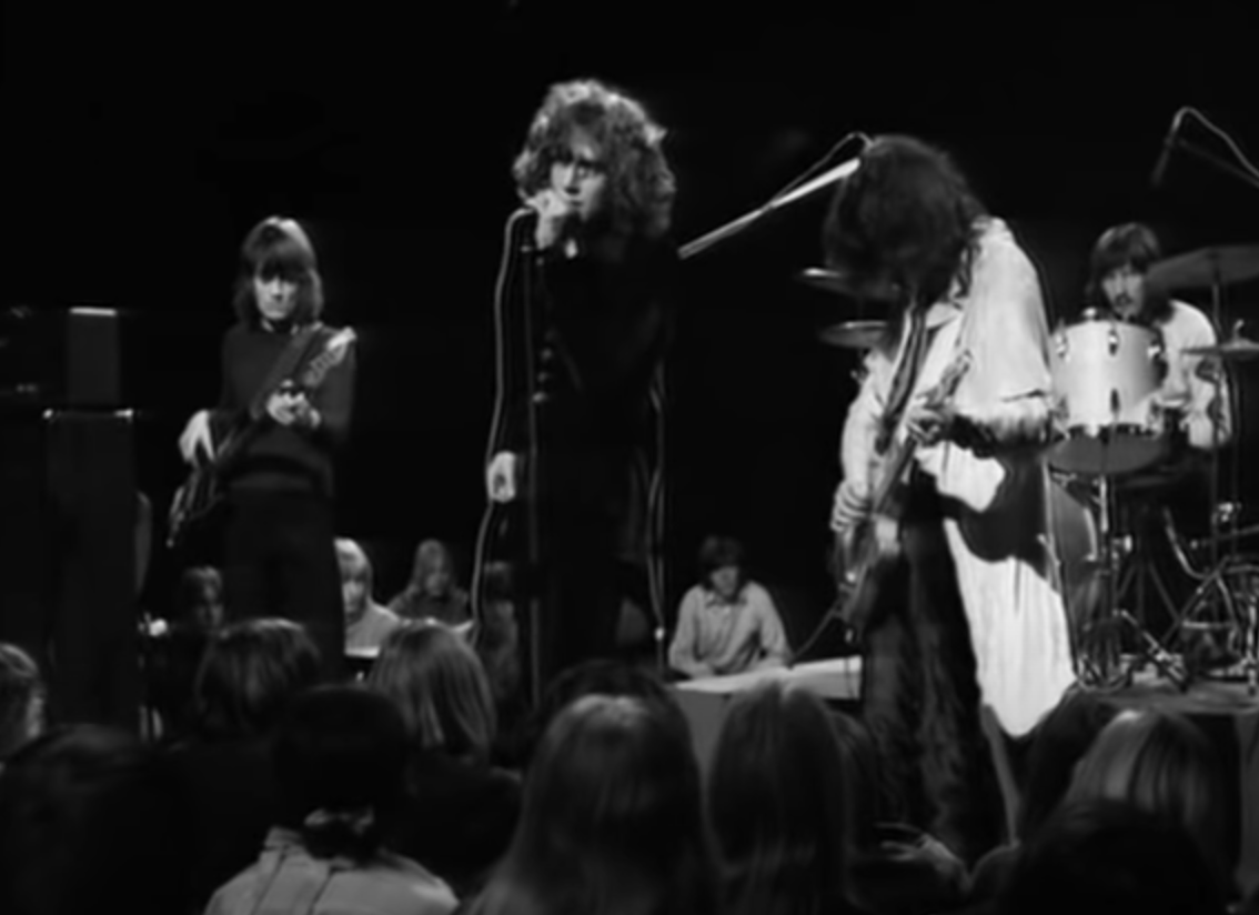 The band in their early years performing onstage