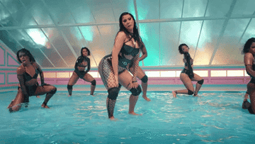 Dancers dancing in pool of water in Cardi B.&#x27;s W.A.P. music video
