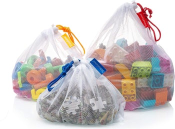 Three mesh bags containing toys