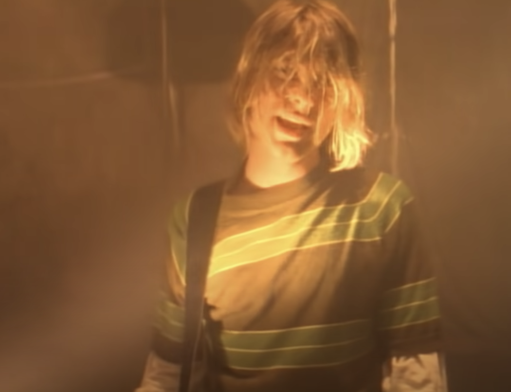 Kurt singing in the music video
