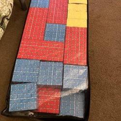 Reviewer's photo showing black underbed storage bag containing toys