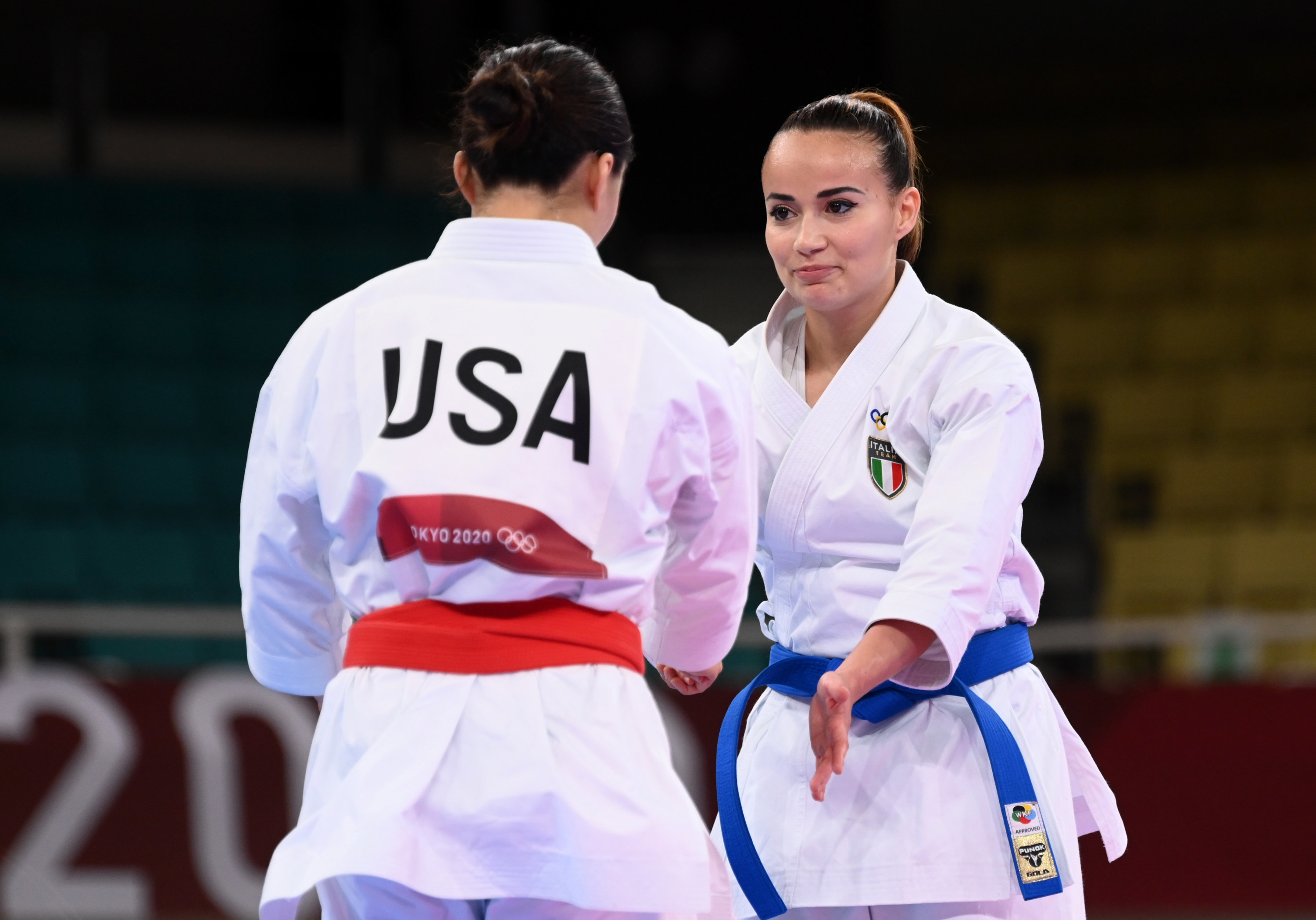 Kokumai of the United States interacts with Viviana Bottaro of Italy after Bottaro won the match.