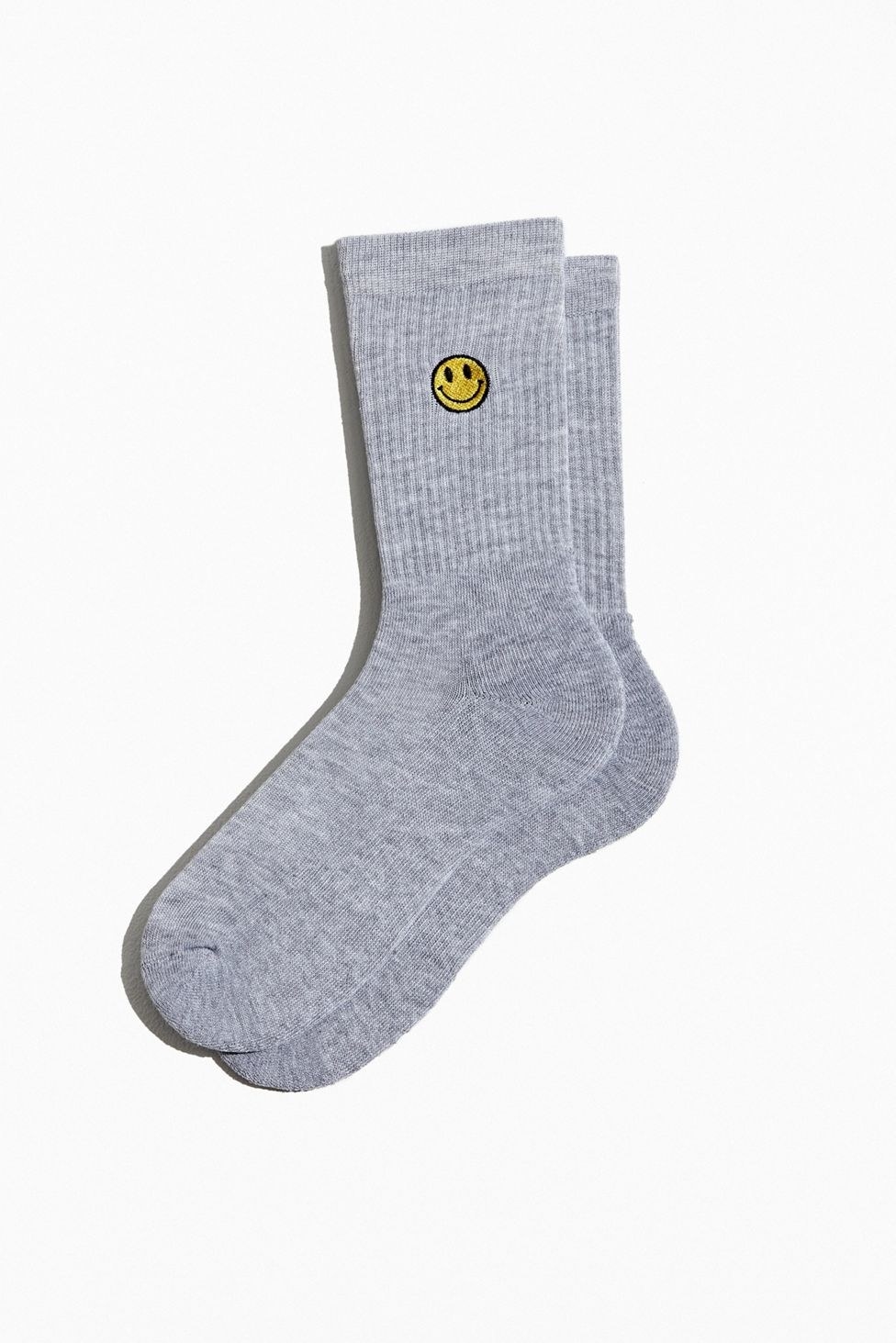 grey crew socks with an embroidered smiley face on the ankle