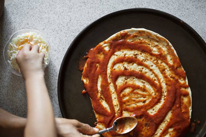 Making pizza from flatbread.