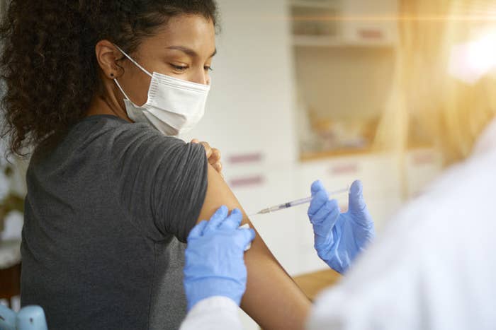A woman getting the vaccine