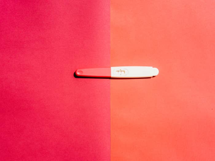 Pregnancy test on pink background