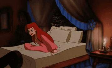 gif from the little mermaid of ariel jumping into bed and smiling