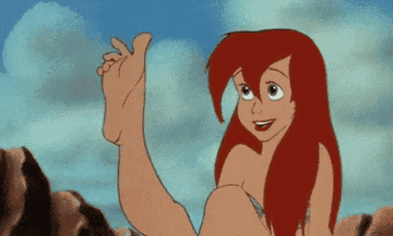 Gif of Ariel from &quot;The Little Mermaid&quot; admiring her foot