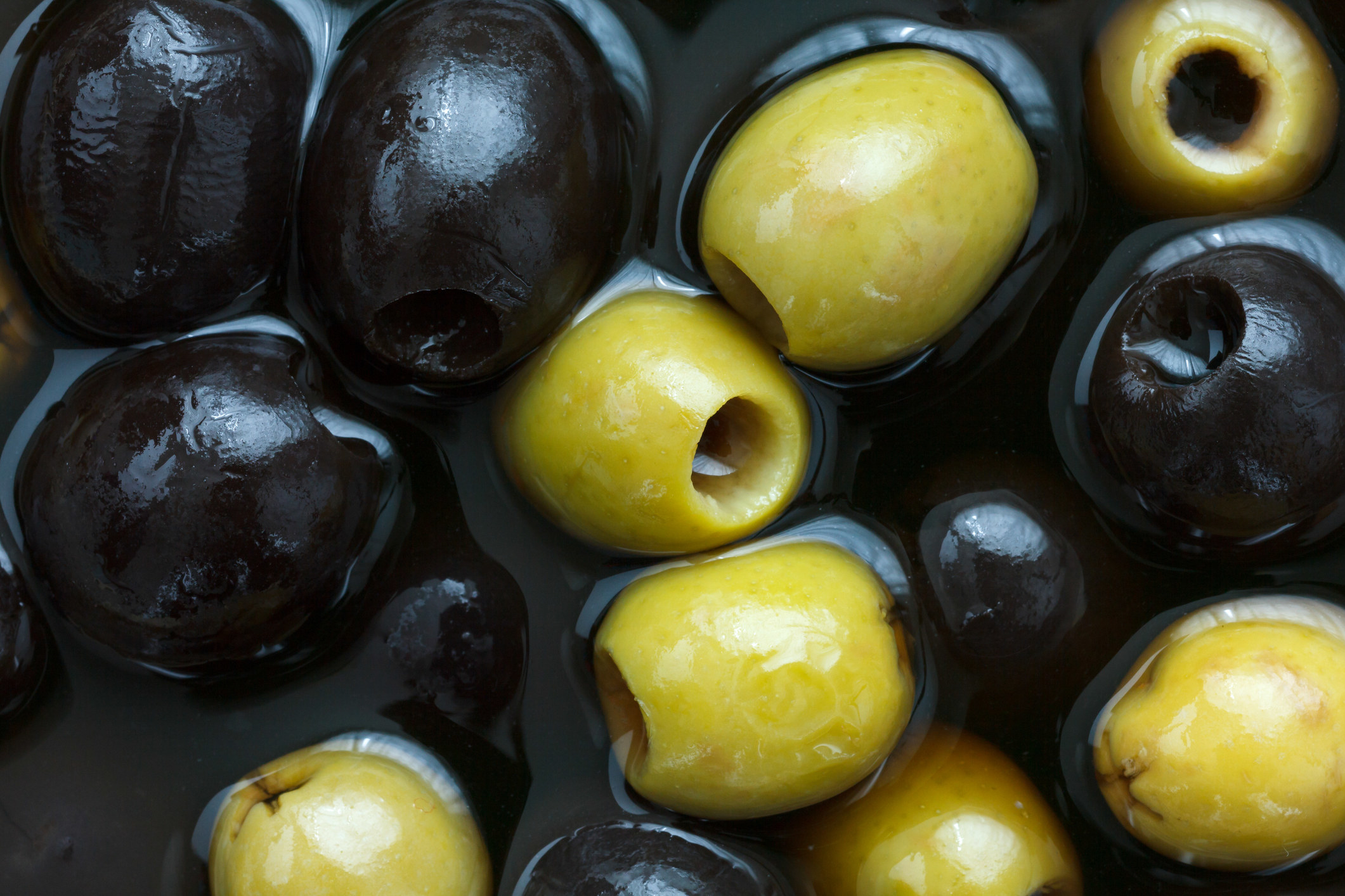 Black and green olives in brine.