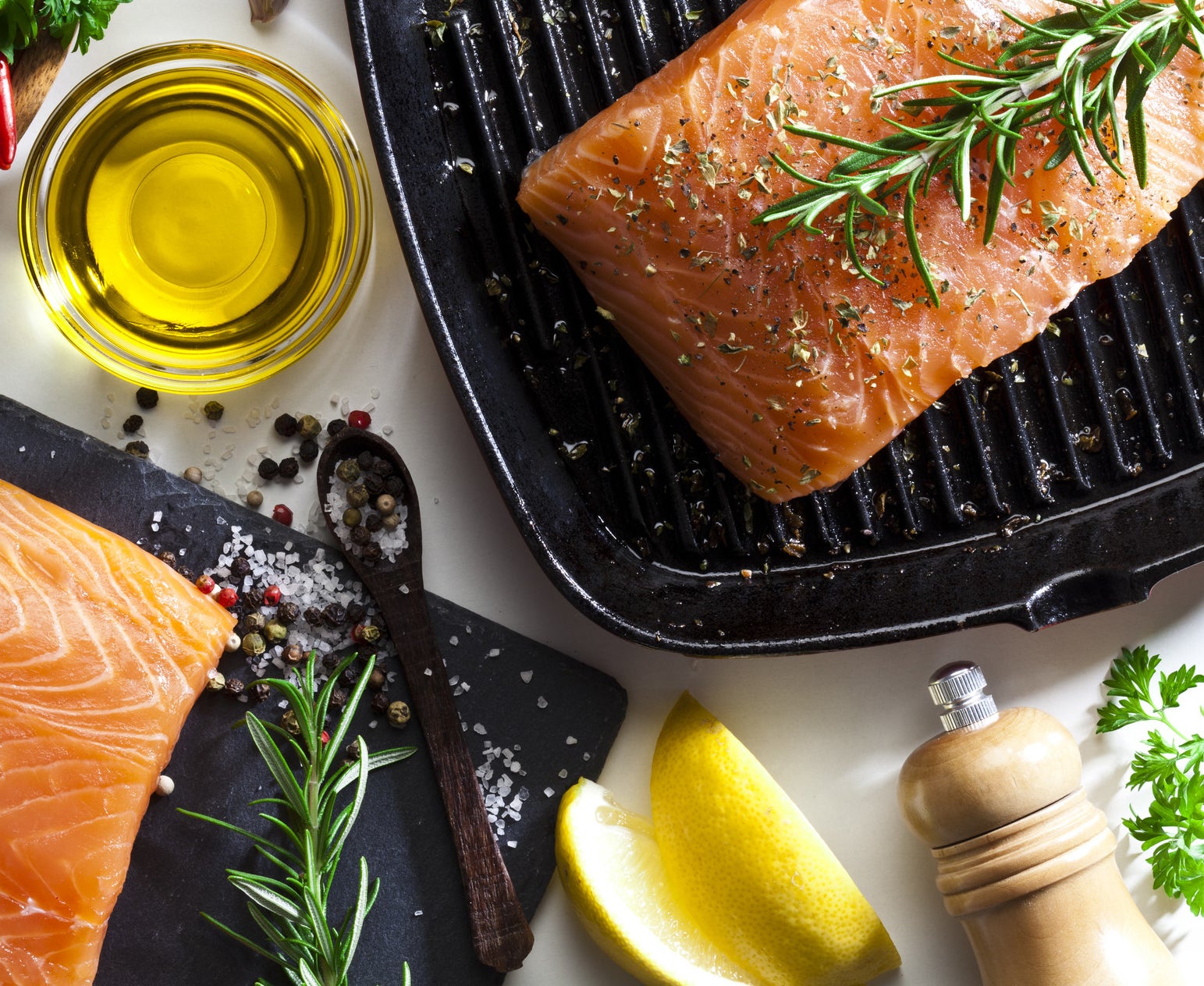 Two pieces of salmon with fresh thyme.