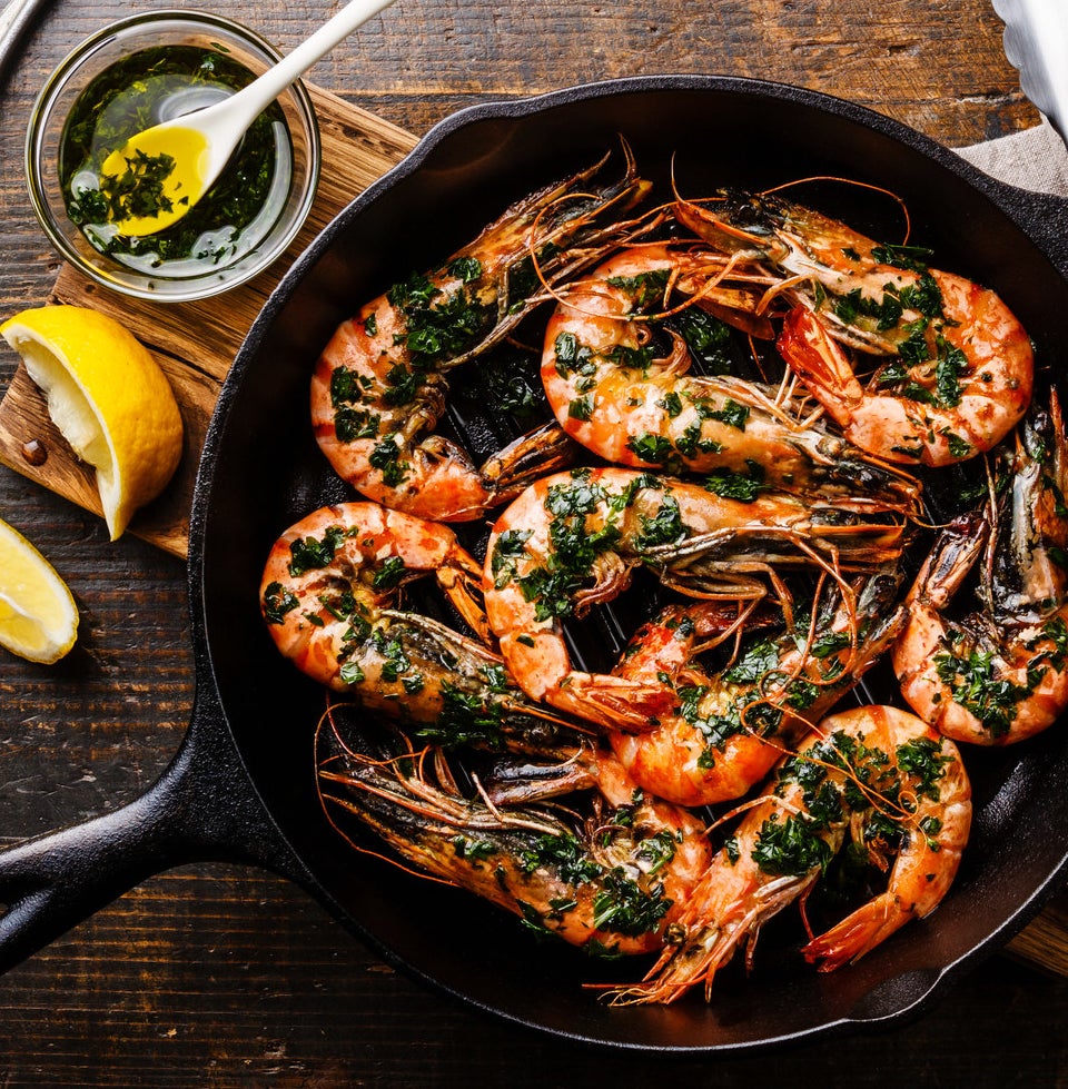 Giant prawns in a cast iron skillet.