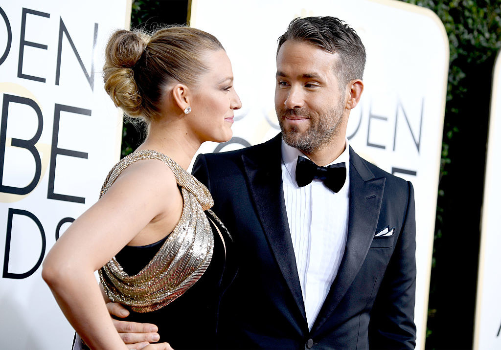 Ryan Reynolds looks lovingly at Blake Lively on the 74th Annual Golden Globe Awards red carpet