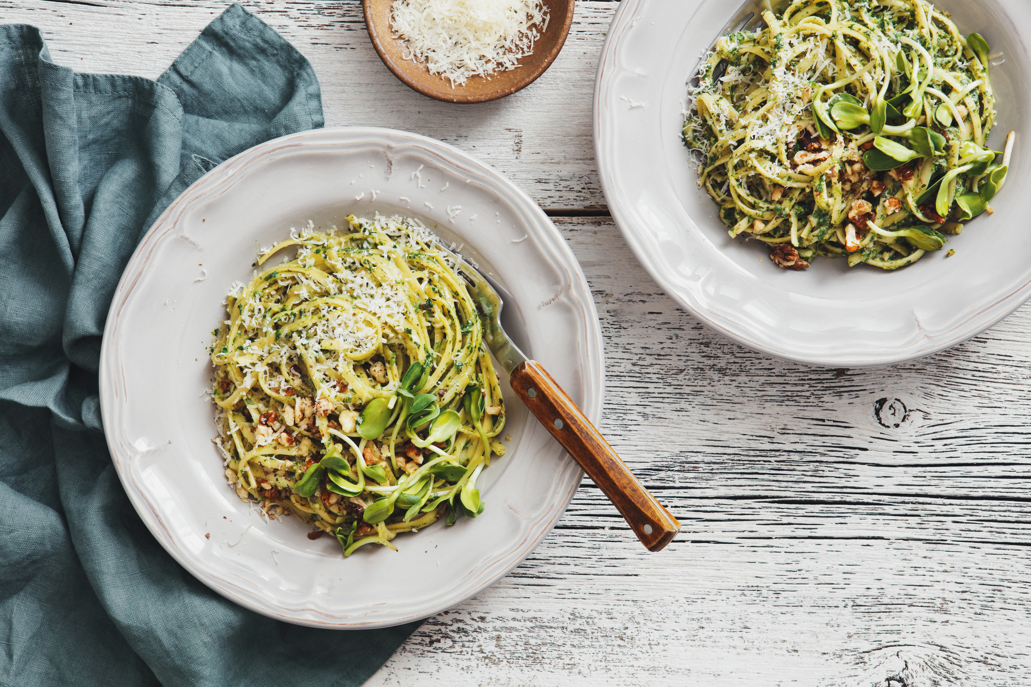 Spaghetti with pesto and cheese.