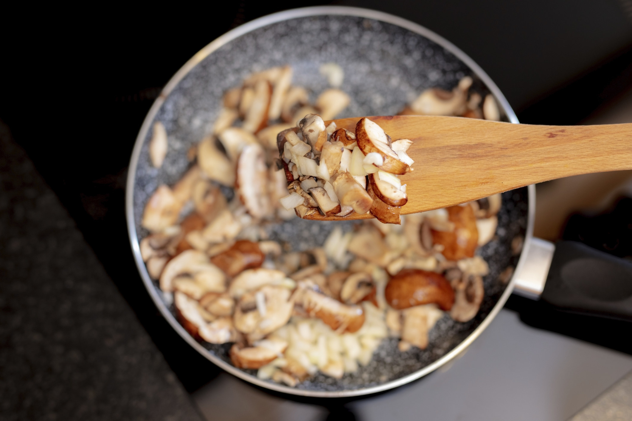 Sautéd mushrooms in a skillet.