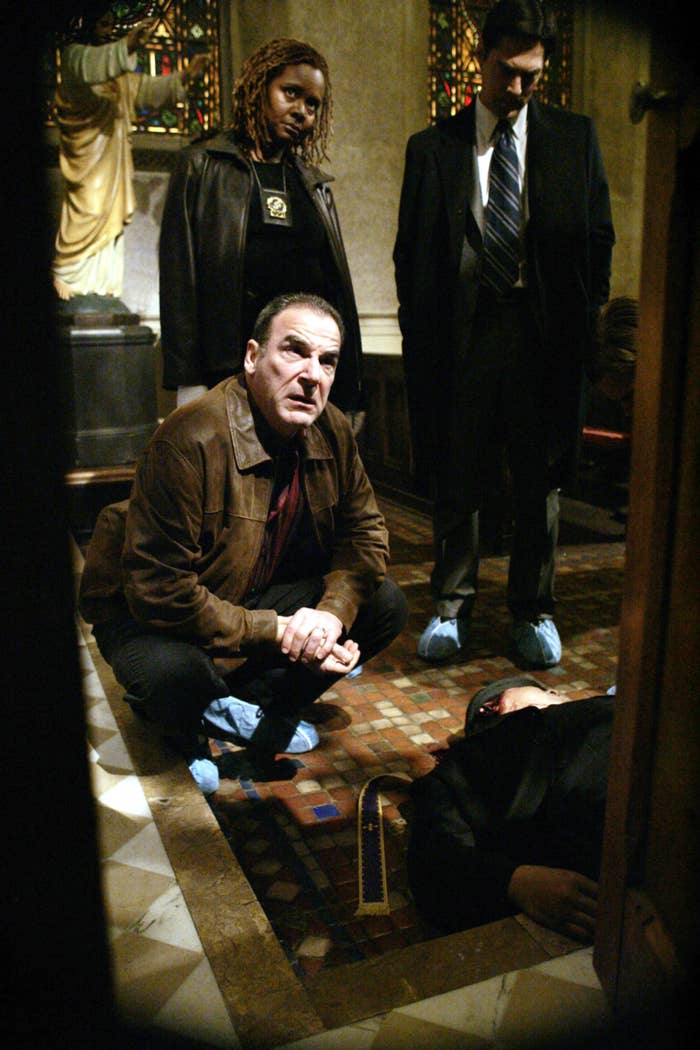Mandy Patinkin crouching over a dead body on the set of &quot;Criminal Minds&quot;