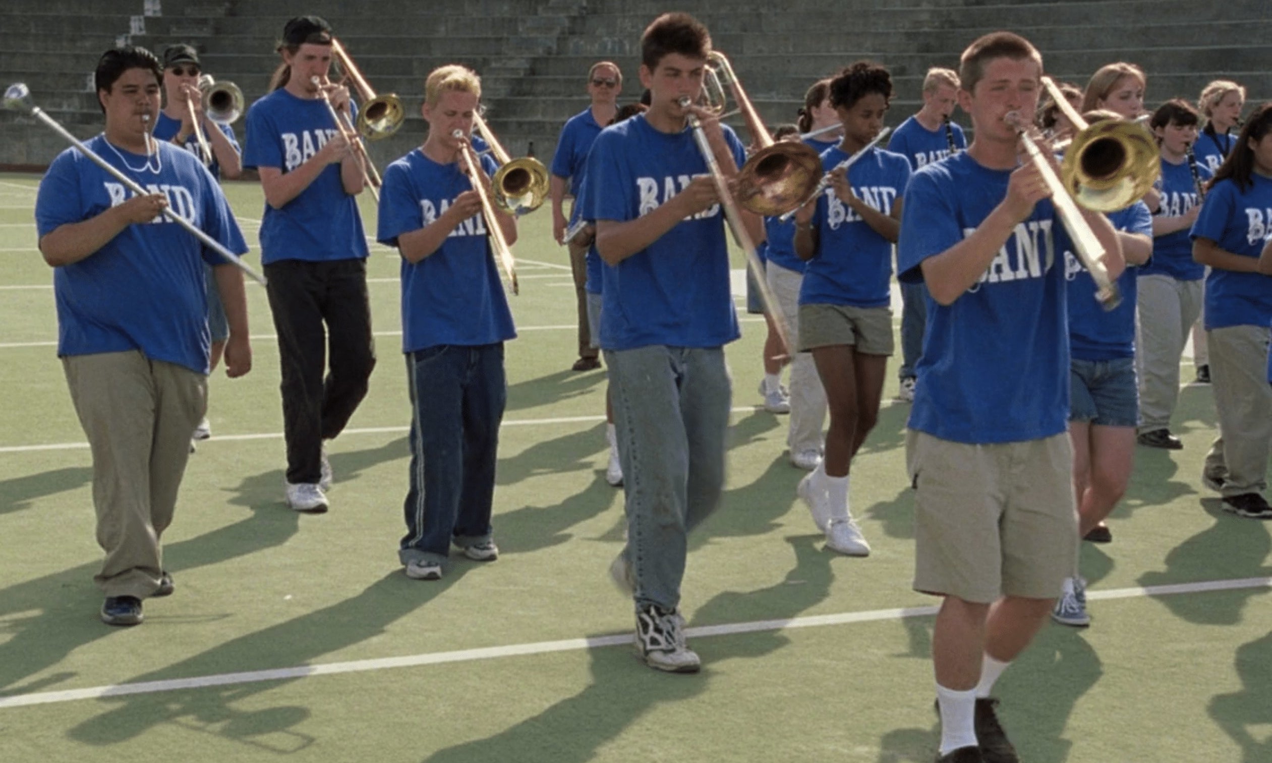 Marching band on football field performs