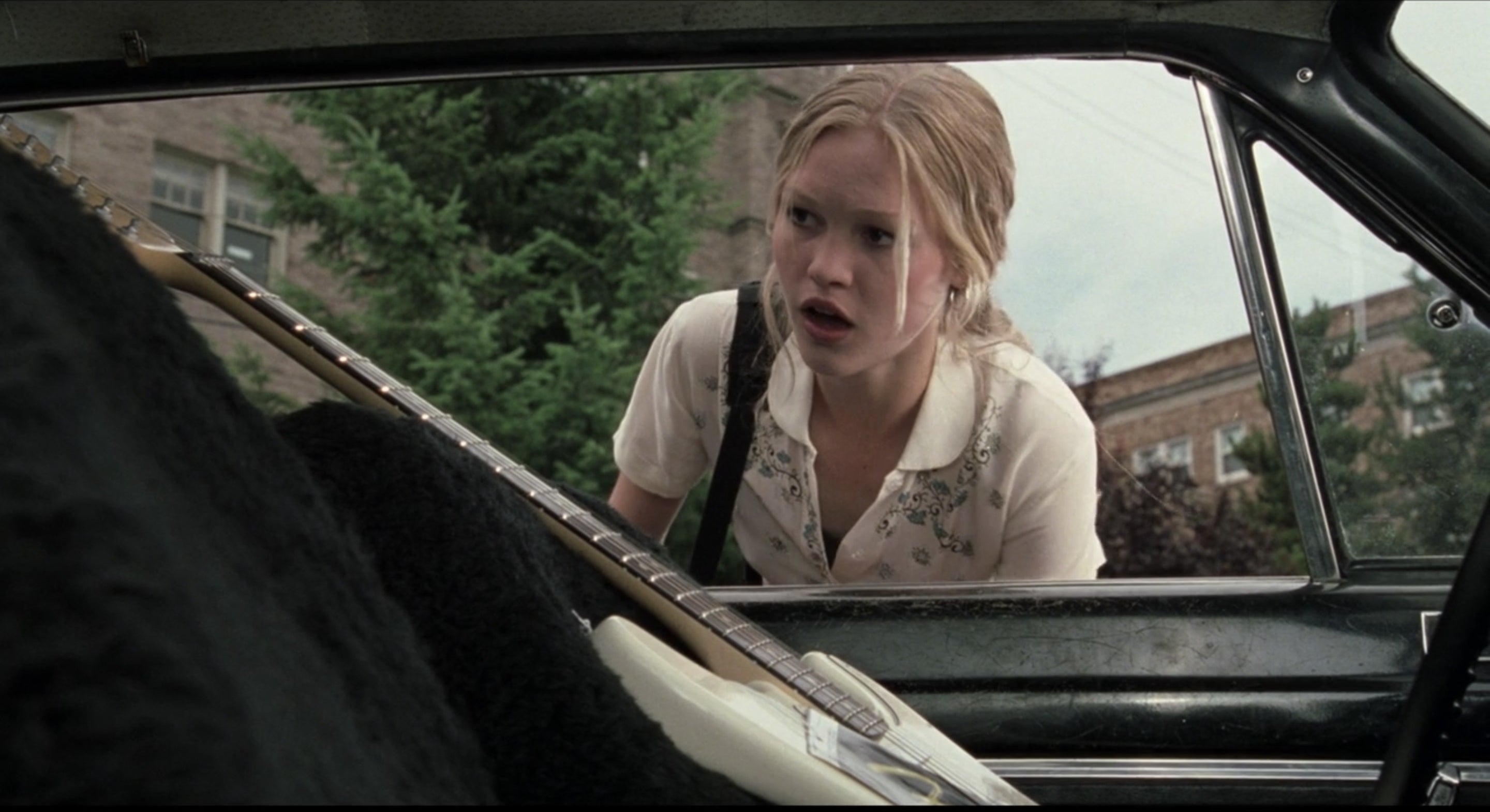 Kat is shocked to see a guitar sitting in her driver's seat
