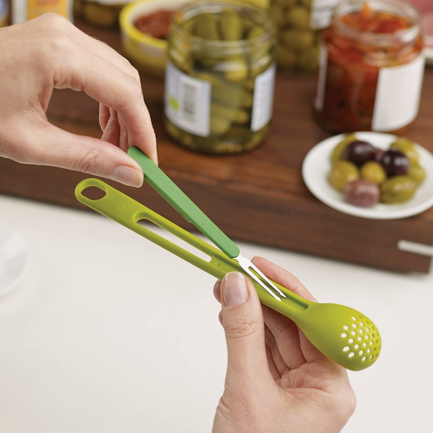 A person putting the skewer into the spoon