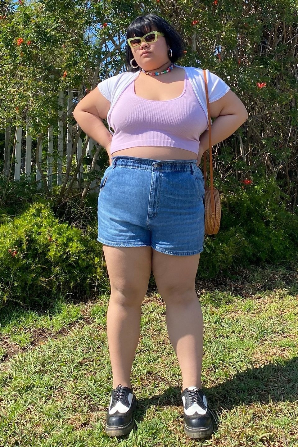 a person in a pink crop top