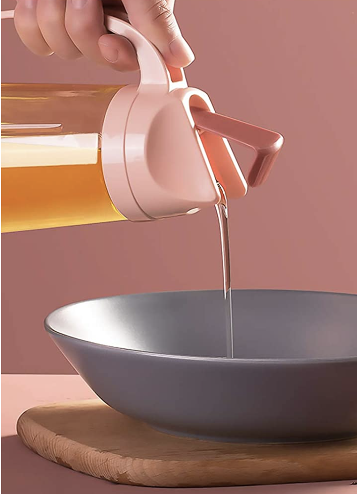 pink oil dispenser pouring oil