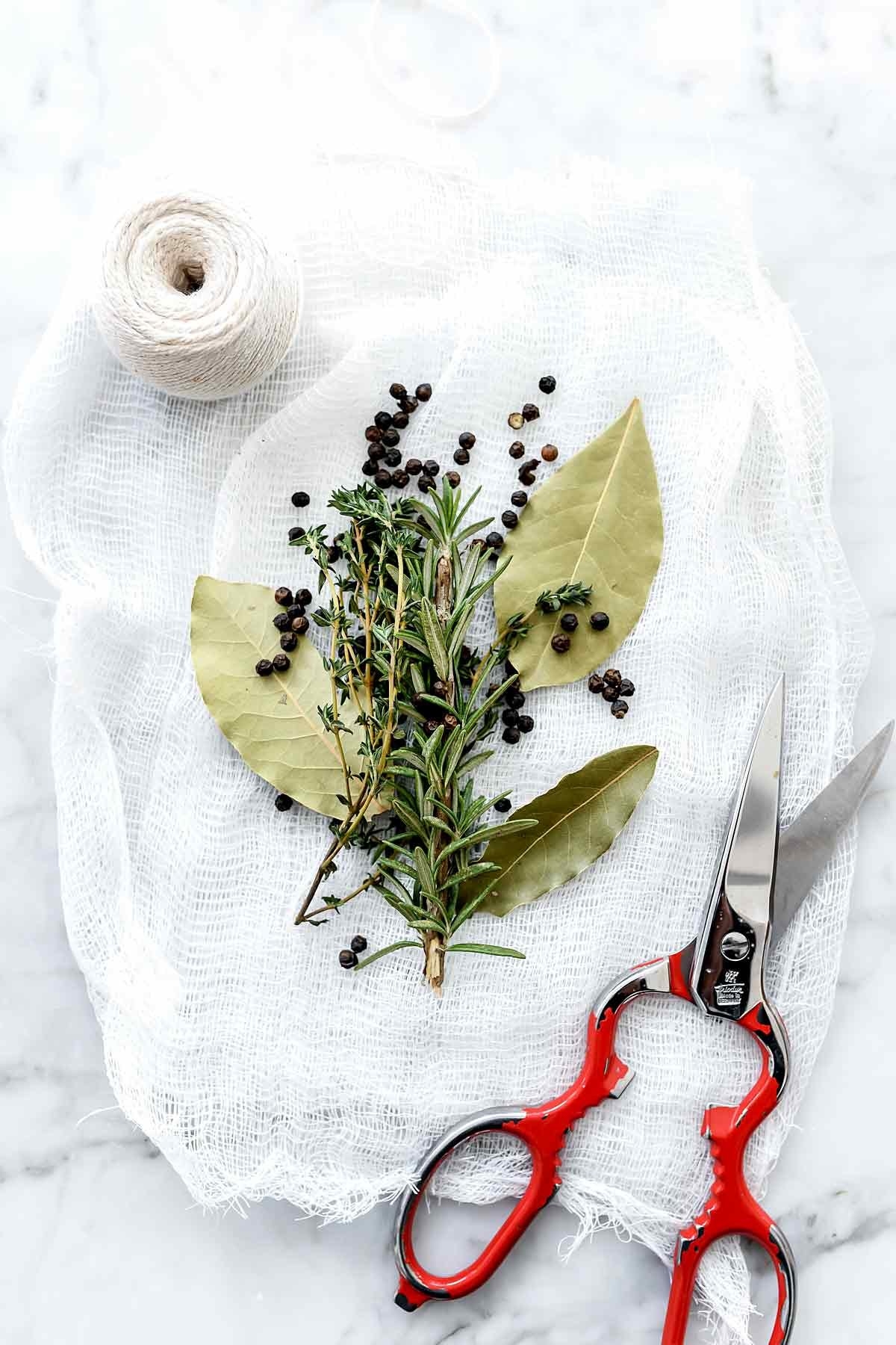 Making a herb packet in cheesecloth.
