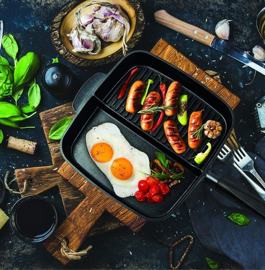 The pan with eggs in one side and sausages in the other