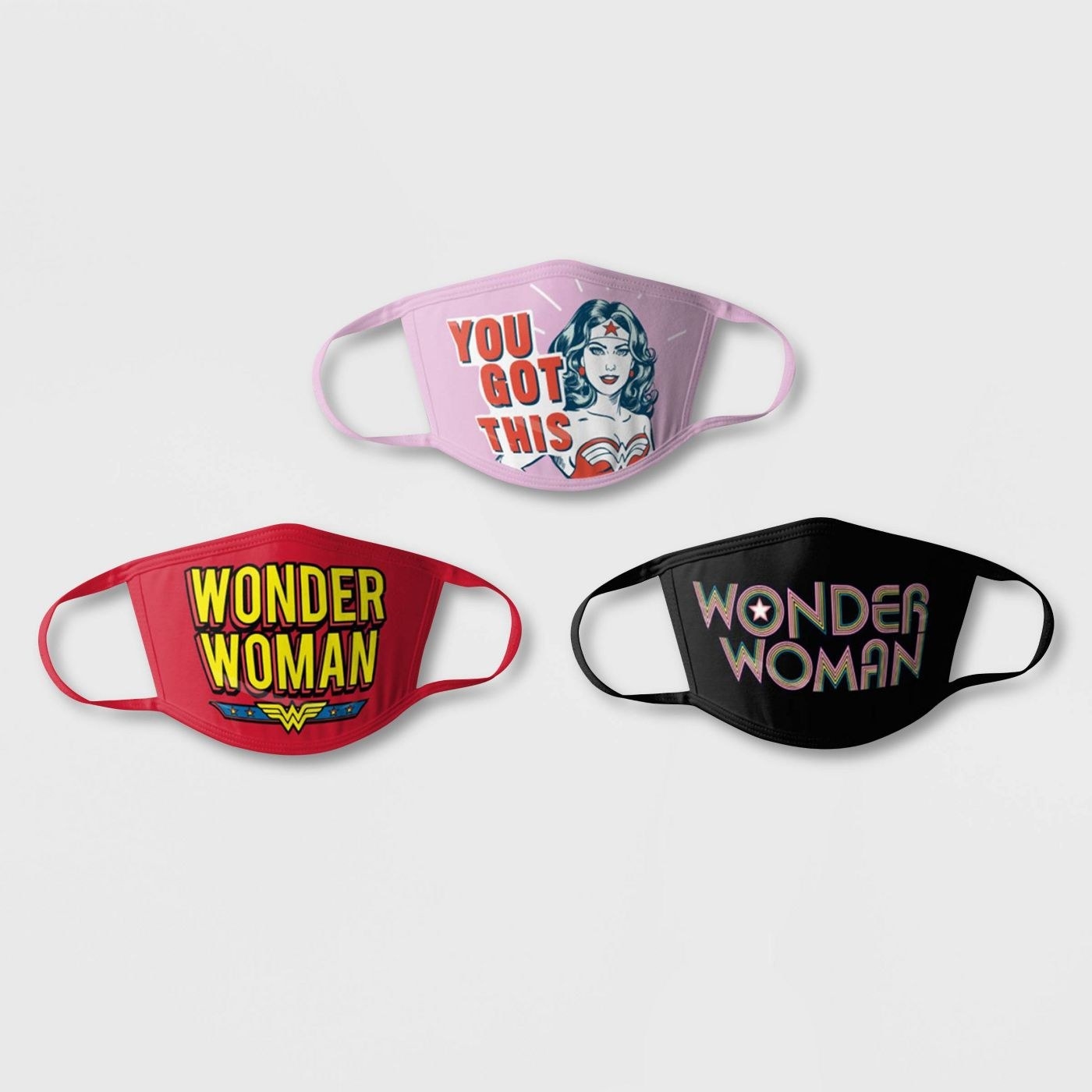 three different colored Wonder Woman cloth face masks