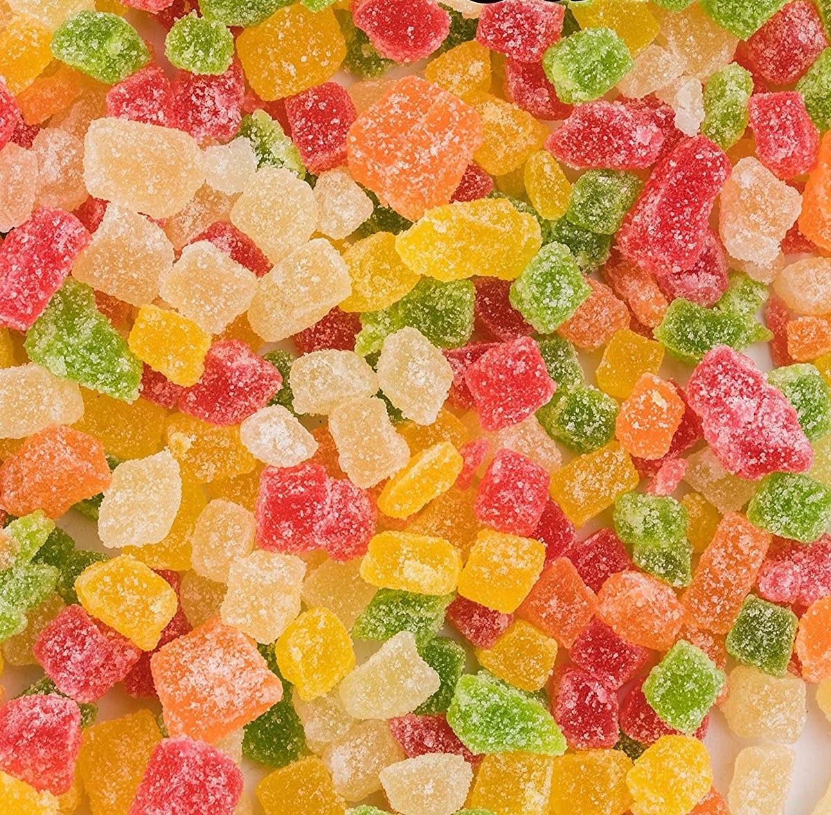 Different coloured jelly cubes spread out over the image with different fruit flavours