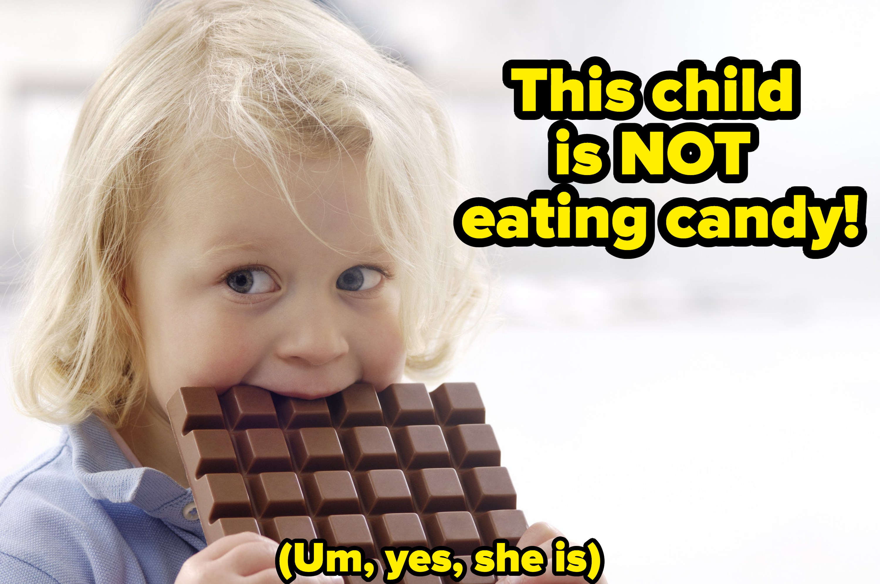 A small child eats a chocolate and the text &quot;she is not eating candy&quot;