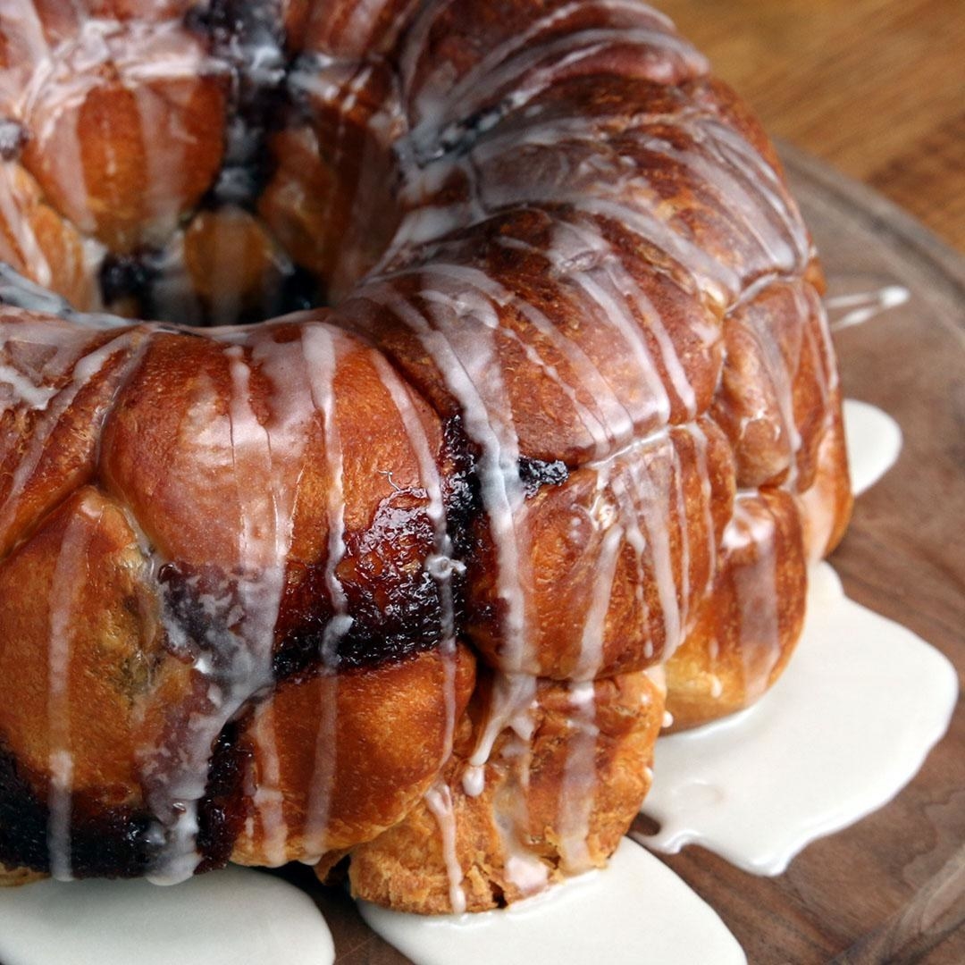 A golden brown Bundt cake with flowing icing