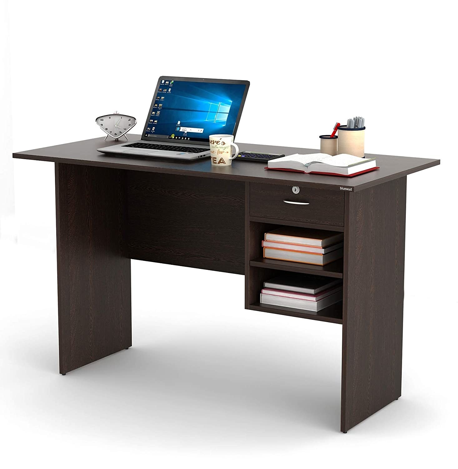 A desk with books and a laptop on it