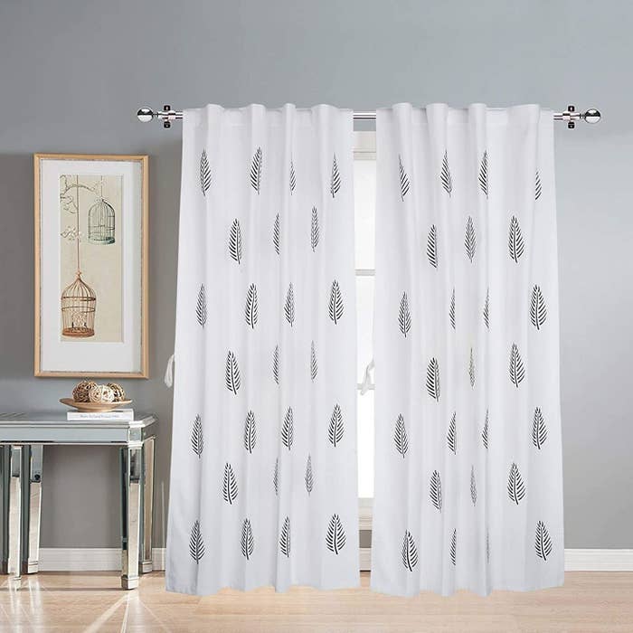 White curtains with a leaf print