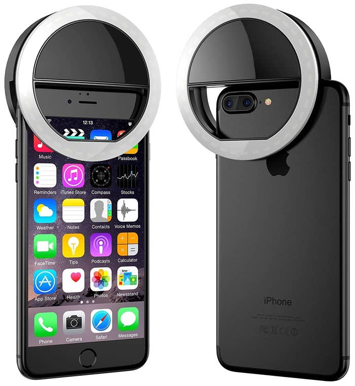 Round selfie light attached on top of an iPhone