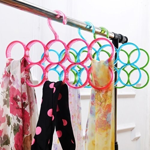 Scarves arranged on the circular loops of the hanger