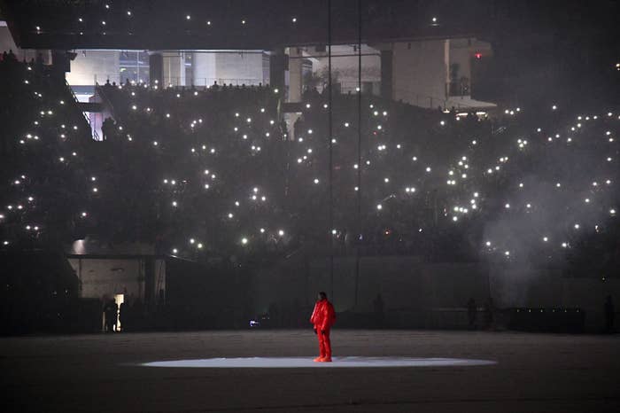 Kanye standing alone in the stadium as his album plays
