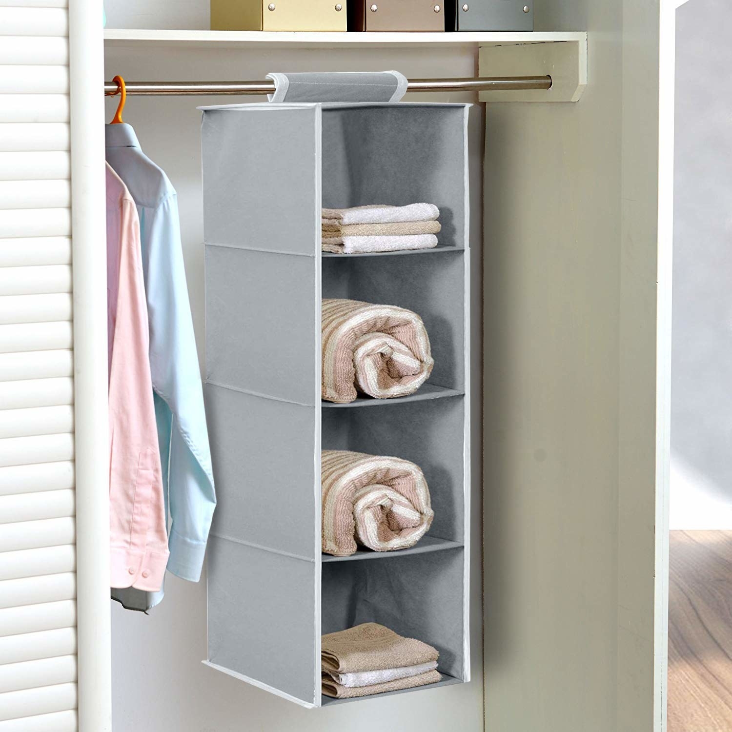 A hanging organiser with clothes in it
