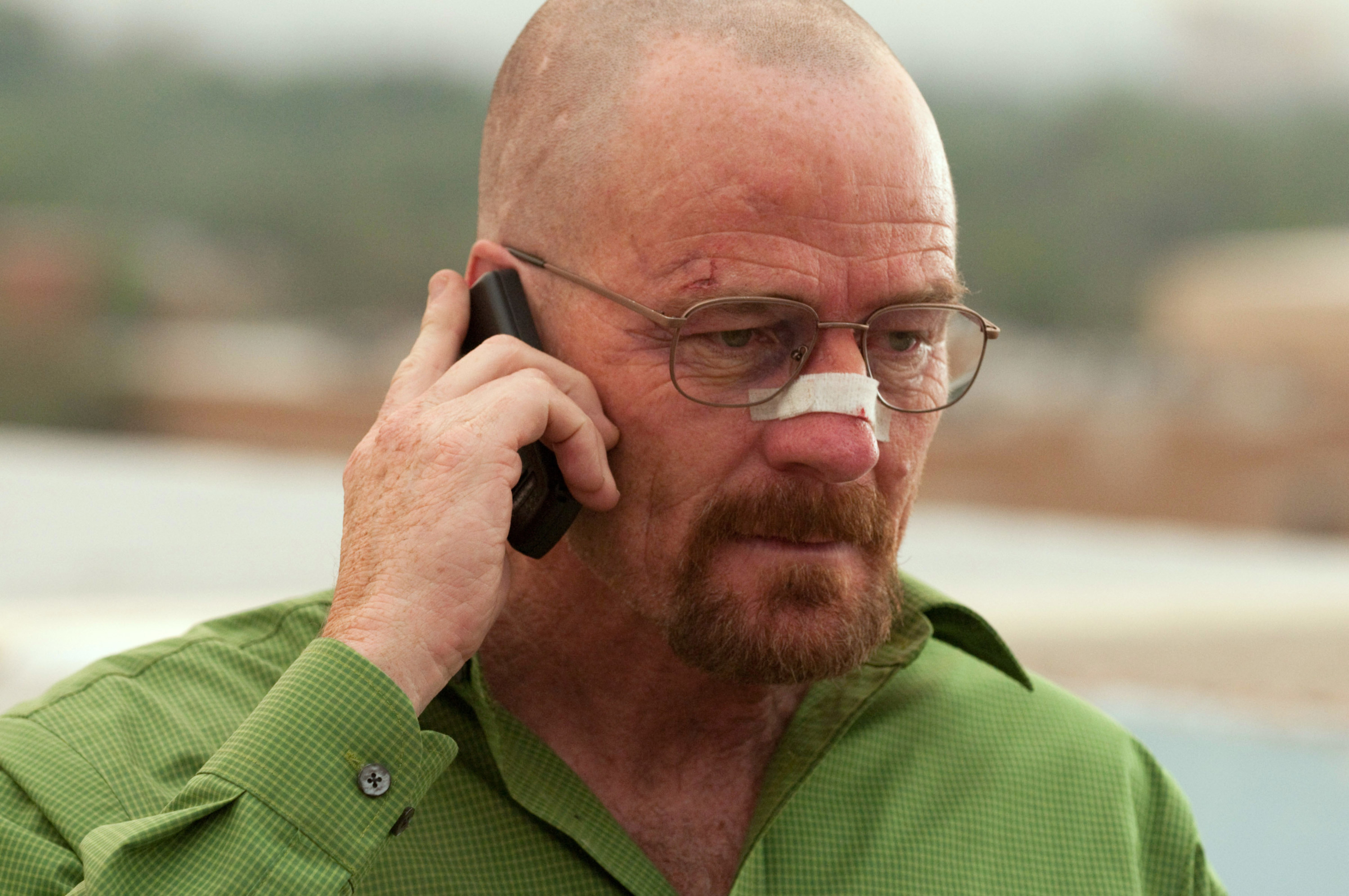 Walter with an injured nose talking on a cellphone