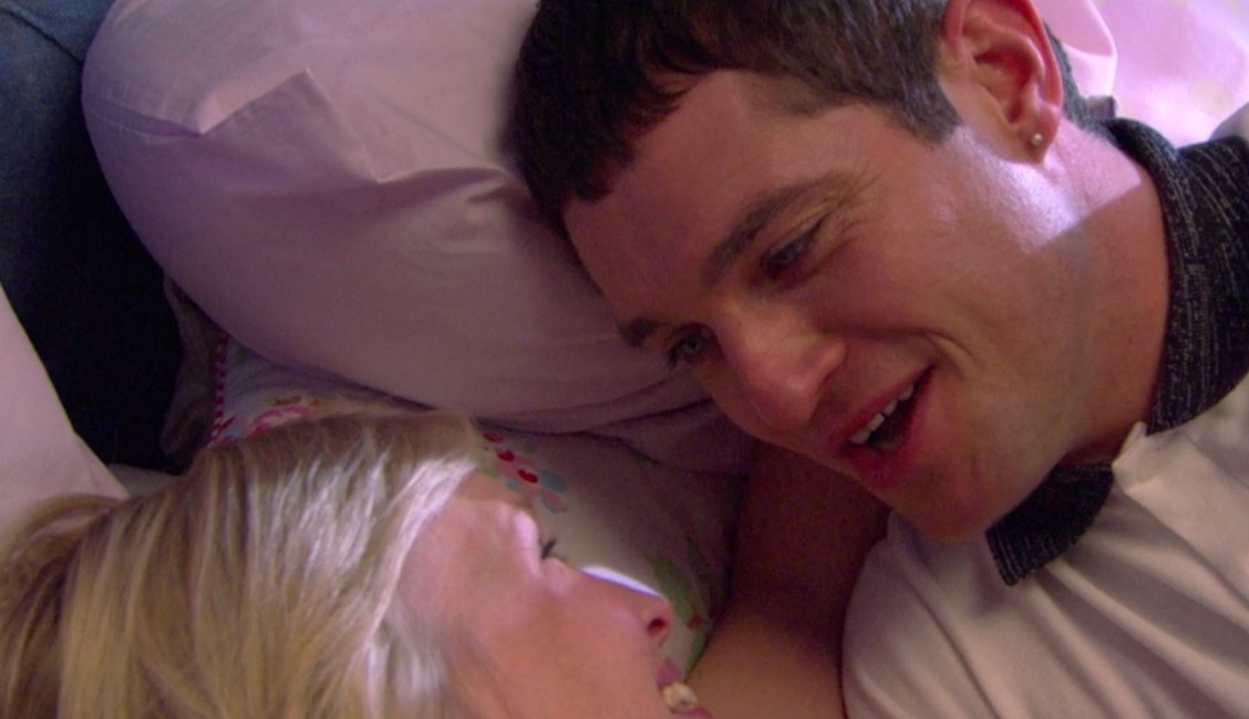 Gavin and Stacey lay on a bed in each other&#x27;s arms smiling