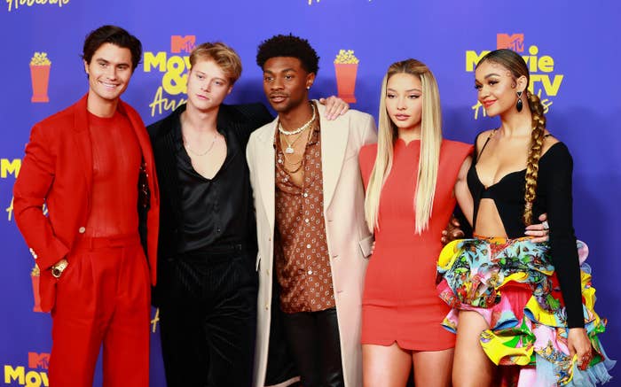 Chase Stokes, Rudy Pankow, Jonathan Daviss, Madelyn Cline, and Madison Bailey are photographed together at the 2021 MTV Movie &amp; TV Awards