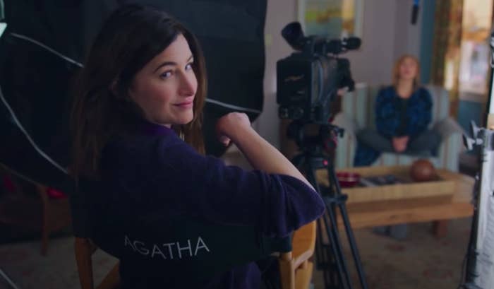 Agatha from "WandaVision" sitting in a director's chair