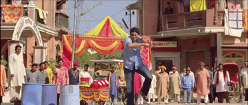scene from Bol Bachan with person rising into the air