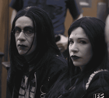 Gif of characters from Portlandia dress in pale makeup and all black