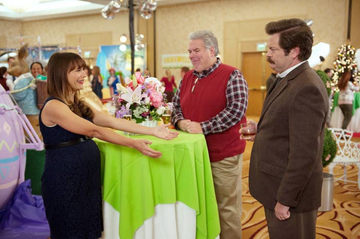 Ann Perkins reaching out to embrace Ron Swanson