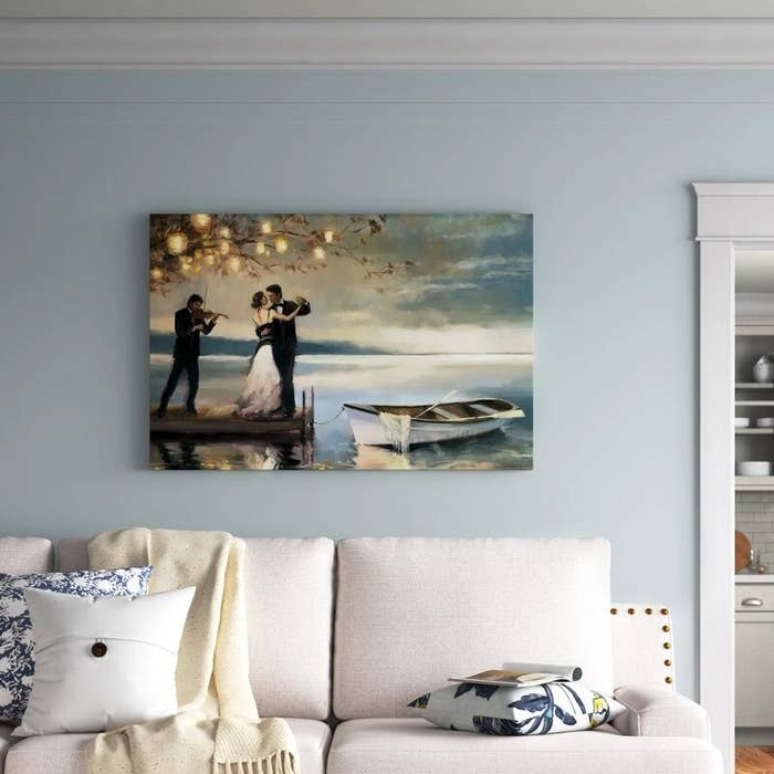An image of canvas art on a living room wall