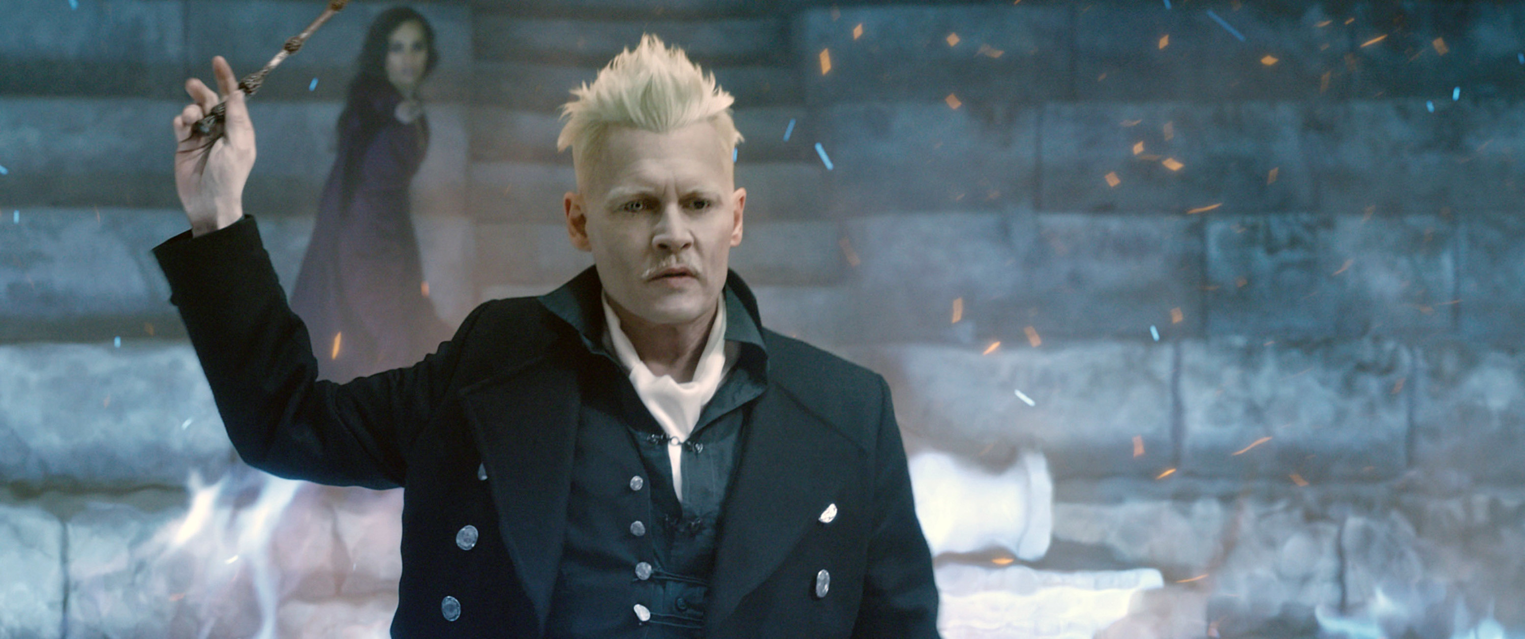 Grindelwald holding up his wand