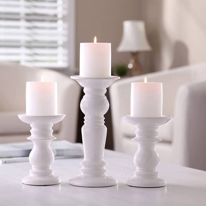 An image of three-piece porcelain candlestick set